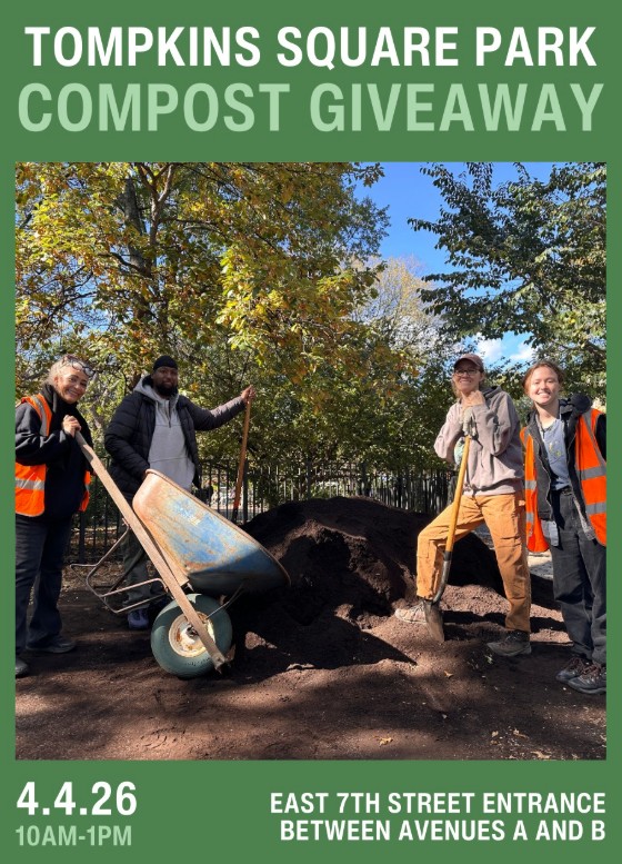 People with shovels and a wheelbarrow posing by a big heap of compost